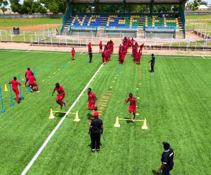 footballers on a sports facility