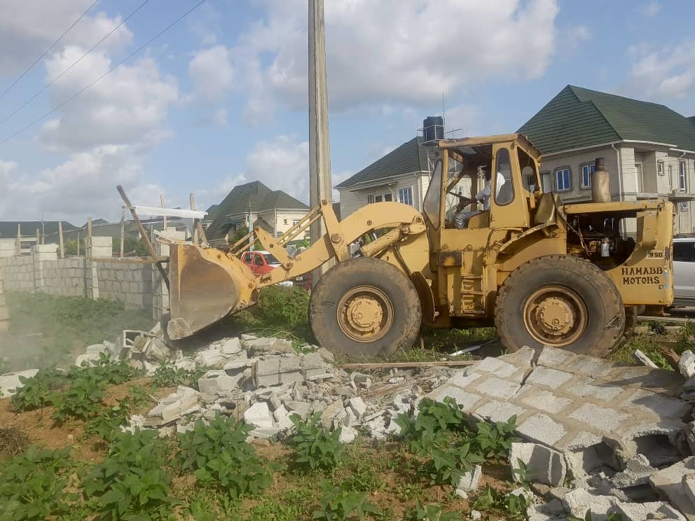 catapillar taking down buildings in Riverpark