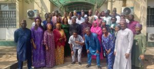 Dr Hayyo in a group photograph with members of staff following resumption in office