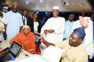 Mahmoud. Maikanlangu with other oficials during the e-registration exercise