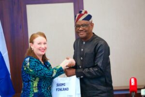 Wike recieving a gift from Selin