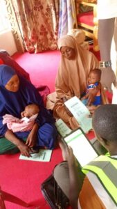 some women participating in the birth registration for their wards