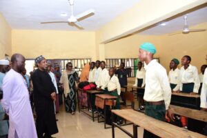 Dr Hayyo with Education officials during his visit to a school