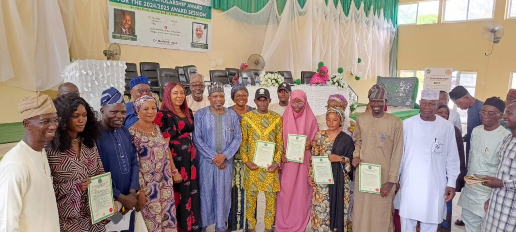 Dr Hayyo with officials of teh education sevretariat and beneficiaries