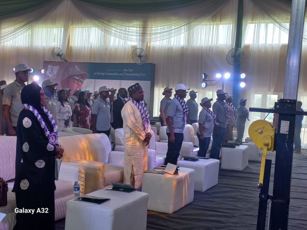 MS Education standing middle with other officials during the event