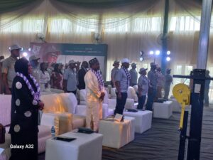 MS Education standing middle with other officials during the event