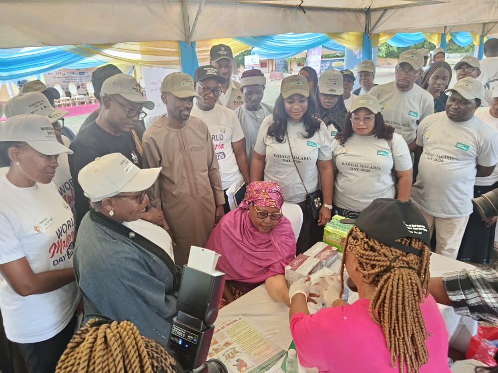 Wammako being tested flanked by Dr Gadzma and partners