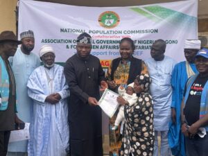 Shekwolo presenting a birth certificate to a parent